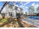 Home backyard featuring a partially-covered pool and deck at 6005 Pattingham Dr, Roswell, GA 30075