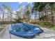 Spacious backyard featuring a partially-covered pool and perimeter fence at 6005 Pattingham Dr, Roswell, GA 30075