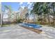 Backyard featuring a partially-covered pool and concrete patio space at 6005 Pattingham Dr, Roswell, GA 30075