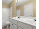 Bright bathroom featuring double sinks, white cabinets, tile flooring, and a tub-shower combo at 6005 Pattingham Dr, Roswell, GA 30075