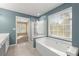 Bathroom featuring a large soaking tub and separate shower at 6005 Pattingham Dr, Roswell, GA 30075