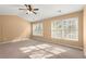 Spacious bedroom with three windows and natural light at 6005 Pattingham Dr, Roswell, GA 30075