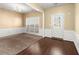 Cozy dining area with hardwood floors, white trim and large windows at 6005 Pattingham Dr, Roswell, GA 30075