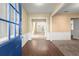 Bright foyer with hardwood floors, and white trim at 6005 Pattingham Dr, Roswell, GA 30075