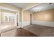 Spacious living room featuring neutral walls, carpeted floors and natural light at 6005 Pattingham Dr, Roswell, GA 30075