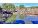 Aerial view of a pond surrounded by lush trees and community buildings at 4008 Bayside Cir, Atlanta, GA 30340