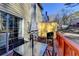 Outdoor back deck featuring a patio table, chairs, grill, yellow storage shed, and house access at 4008 Bayside Cir, Atlanta, GA 30340