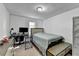 Cozy bedroom with simple decor, functional workspace, and a neutral color palette at 4008 Bayside Cir, Atlanta, GA 30340