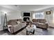 Bright living area with a cozy fireplace, large window and sleek furniture arrangement at 4008 Bayside Cir, Atlanta, GA 30340