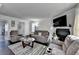 Open living area with fireplace and large windows adjacent to the dining room at 4008 Bayside Cir, Atlanta, GA 30340