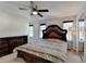 Comfortable main bedroom featuring a decorative bed frame, ceiling fan, and natural light at 4008 Bayside Cir, Atlanta, GA 30340