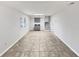Spacious basement with a wet bar, neutral tile flooring, and bright white walls at 43 Landmark Sw Ln, Marietta, GA 30060