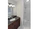 Well-lit bathroom with a white shower and stone countertops at 43 Landmark Sw Ln, Marietta, GA 30060