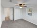 Cozy bedroom featuring a ceiling fan, carpet, and closet space at 43 Landmark Sw Ln, Marietta, GA 30060