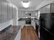 Well-equipped kitchen with grey cabinets, stone countertops and modern appliances at 43 Landmark Sw Ln, Marietta, GA 30060