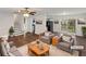 Bright living room with hardwood floors, ceiling fan, and sliding door to deck at 43 Landmark Sw Ln, Marietta, GA 30060