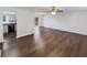 Open-concept living room with hardwood floors, white walls and walk out access at 43 Landmark Sw Ln, Marietta, GA 30060