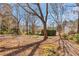 Expansive backyard with mature trees offers serene privacy at 1006 Walnut Dr, Lawrenceville, GA 30044