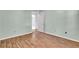 Bright bedroom featuring durable hardwood floors and neutral walls at 1006 Walnut Dr, Lawrenceville, GA 30044