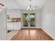 Bright dining room featuring wood floors and glass doors leading to an outdoor space at 1006 Walnut Dr, Lawrenceville, GA 30044