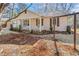 Side view of a charming home, showcasing the front porch, landscaped yard, and well-kept exterior at 1006 Walnut Dr, Lawrenceville, GA 30044