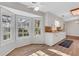 Sunlit kitchen boasts white cabinetry, wood countertops, and an adjacent dining area with large windows at 1006 Walnut Dr, Lawrenceville, GA 30044