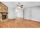 Bright living room with hardwood floors, stone fireplace, and neutral walls, offering a flexible layout at 1006 Walnut Dr, Lawrenceville, GA 30044