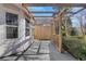 The covered patio with pergola detailing the home's exterior, showing access and outdoor living space at 1006 Walnut Dr, Lawrenceville, GA 30044