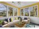 Bright sunroom featuring neutral furniture and colorful accents, perfect for relaxation with a view at 1006 Walnut Dr, Lawrenceville, GA 30044