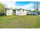 Back of house with deck overlooking a spacious backyard at 1877 Glenmar Dr, Decatur, GA 30032