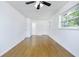 Spacious living room features hardwood floors, white walls, ceiling fan, and natural light at 1877 Glenmar Dr, Decatur, GA 30032