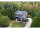 Aerial shot showcases a home's landscaped yard and charming curb appeal at 203 Glenrise Ct, Woodstock, GA 30188