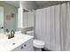 Neutral bathroom featuring a single vanity with a white shower curtain at 203 Glenrise Ct, Woodstock, GA 30188