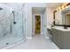 Beautiful bathroom with marble-look shower and double sinks at 203 Glenrise Ct, Woodstock, GA 30188