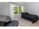 Cozy bedroom with natural light and comfortable seating area at 203 Glenrise Ct, Woodstock, GA 30188