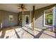 Inviting covered patio features a ceiling fan and stamped concrete flooring at 203 Glenrise Ct, Woodstock, GA 30188