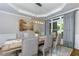 Elegant dining room with modern lighting, table, and neutral decor at 203 Glenrise Ct, Woodstock, GA 30188