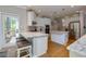 Modern kitchen featuring marble counters, hardwood floors and stainless steel appliances at 203 Glenrise Ct, Woodstock, GA 30188