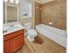 Bathroom featuring a tiled floor, a soaking tub, and a wood vanity at 3628 Princeton Ave, Atlanta, GA 30337