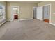 Spacious, sunlit bedroom with neutral carpet, multiple closets, and ensuite access to a bathroom at 3628 Princeton Ave, Atlanta, GA 30337