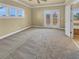 Bedroom with carpet, patio access, trim, and natural light at 3628 Princeton Ave, Atlanta, GA 30337