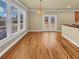 Cozy dining area with hardwood floors, bright windows, and access to outdoor deck at 3628 Princeton Ave, Atlanta, GA 30337