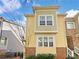 Charming home with stone accents, light yellow siding and a welcoming façade at 3628 Princeton Ave, Atlanta, GA 30337