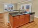 Kitchen featuring granite countertops, stainless steel dishwasher, and a breakfast bar at 3628 Princeton Ave, Atlanta, GA 30337