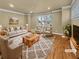 Bright living room featuring hardwood floors, neutral paint, and a large window at 3628 Princeton Ave, Atlanta, GA 30337