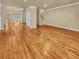 Spacious living room with hardwood floors, crown molding, and staircase access at 3628 Princeton Ave, Atlanta, GA 30337