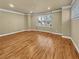 Bright living room featuring hardwood floors, neutral paint, and a large window at 3628 Princeton Ave, Atlanta, GA 30337