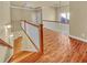 Wooden staircase with white railing leading to the upper level and bedrooms at 3628 Princeton Ave, Atlanta, GA 30337