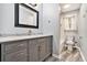 Bathroom with gray vanity, marble countertop, and shower/tub combo at 4141 Willow Ridge Rd, Douglasville, GA 30135