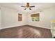 Bedroom with hardwood floors, ceiling fan, neutral paint, and dual windows at 4141 Willow Ridge Rd, Douglasville, GA 30135